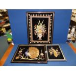 Three framed embroidered and beaded pictures depicting birds and flowers.