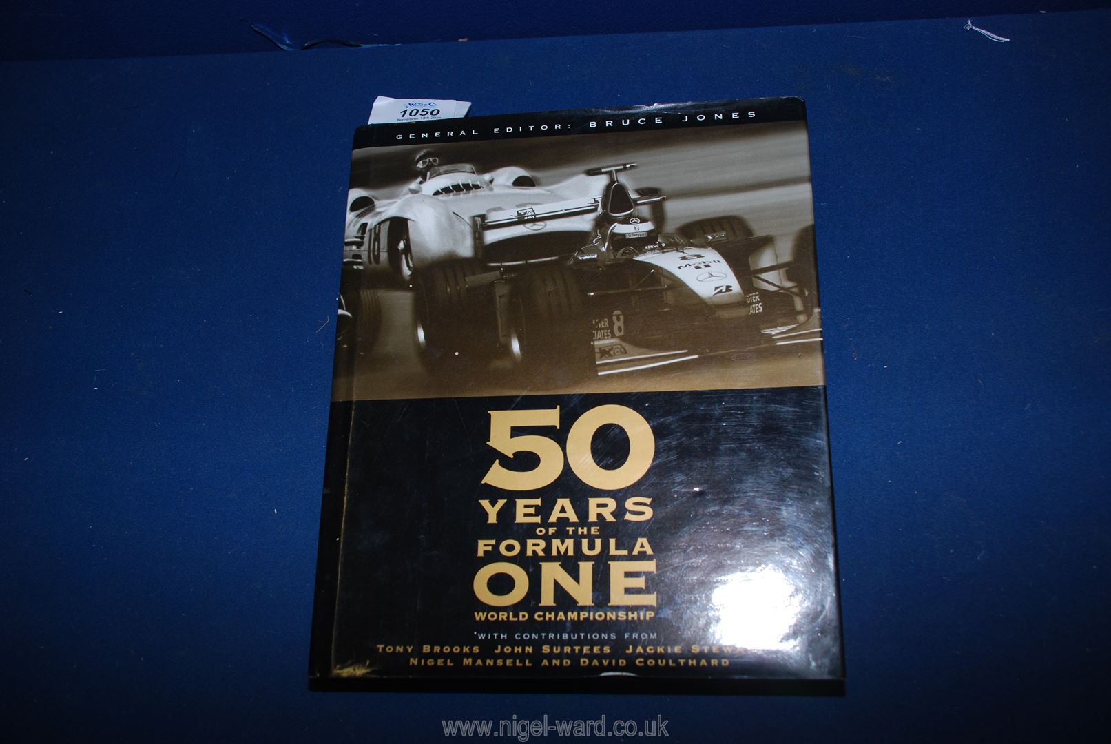 A first edition book, Fifty Years of Formula One 1999.