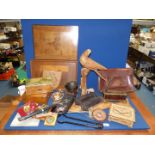 A carved wooden parrot with a collection of boxes including; musical, leather satchel,