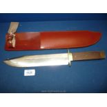 A large Bowie knife with sheath. Made in Sheffield by J.