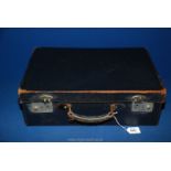 An early 20th c. Vanity case in blue Moroccan leather lined with silk, 18'' x 12''.