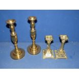 Two pairs of brass Candlesticks including intricate design and square base,