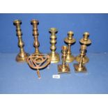 Three pairs of brass candlesticks including square based,