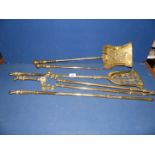 A set of brass Fire Irons and a smaller brass coal shovel and poker