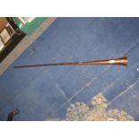A copper hunting horn, 49 1/2" long.