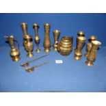 A quantity of brass bud vases with leaf engravings, a teapot without a lid, a jug,