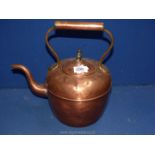 A large copper kettle.