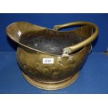 A brass coal bucket.