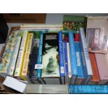 A box of cookbooks: The International Trout and Salmon Cookbook, The Carved Angel Cookbook,