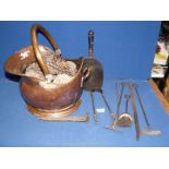 A Copper coal bucket, scoop and fire irons.