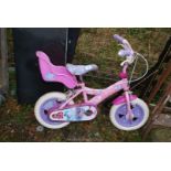 Small pink child's bike.