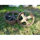 Two cast iron trolley or hut wheels.