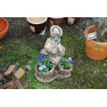 Concrete Duck planter with Winter Pansies.