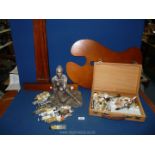 A sculpture of a seated woman, a box of old oil paints with antique Winsor & Newton T square, etc.