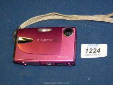 A Fuji-film Fine-pix Z20 digital camera, boxed with instructions, charger and cable.