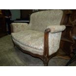 A Mahogany show framed two seater Sofa standing on scroll front legs and upholstered pale beige
