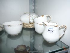 A Royal Crown Derby gilt rimmed 'Regency' part Teaset, including six cups, six saucers,