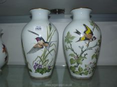 A pair of Franklin Mint vases, 'Woodland Bird' and 'Meadowland Bird', 11 1/2" tall.