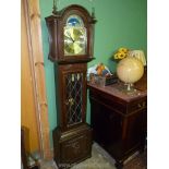 A contemporary Oak longcase Clock, the face with Roman numerals having moon phases to the arch,