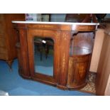 A circa 1900 Walnut Credenza having a central mirrored door flanked by bowed door cupboards and