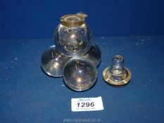 An iridescent glass bubble Inkwell, lid with brass collar, a/f, 5'' tall.