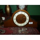 A German mantle clock, with Westminster chimes, with key.