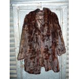 A 3/4 length dark fur Coat with revere collar, plain brown lining, size M.