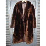 A Beaver Lamb fur Coat, made in Hungary, shawl collar, hook and eye fastening, striped lining,