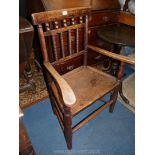 An unusual and elegant Arts & Crafts mixed hardwoods wide solid seated, open armed elbow Chair,