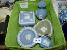 A small box of blue & white Wedgwood Jasperware trinket dishes, lighter, bud vase, etc.