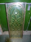 A double glazed feature Panel with bevelled and cut detail with an arch and stylised foliage,