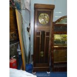 An Oak cased Longcase Clock having a brass finished face with Arabic numerals,