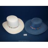 A blue canvas covered cowboy Hat with beaded trim by Santa Fe and a Western Express Inc.