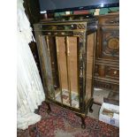 A black lacquered bow fronted Chinoiserie china Display Cabinet decorated in gold and poly chrome