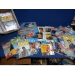 A large quantity of Elvis Monthly Magazines and seven Elvis CD's.