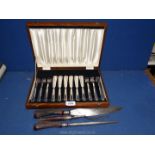 A cased set of plated knives and forks and carving set.