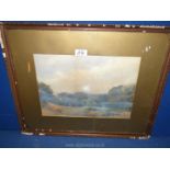 A framed and mounted watercolour depicting a rural landscape with trees and rolling hills in the