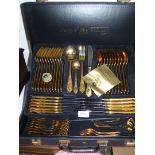 A cased Bestecke Solingen 24 kt plated canteen of cutlery with lower layer including ladles,