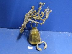 A wall mounting brass monastery style bell having brass bell-pull handle, 12'' high overall.