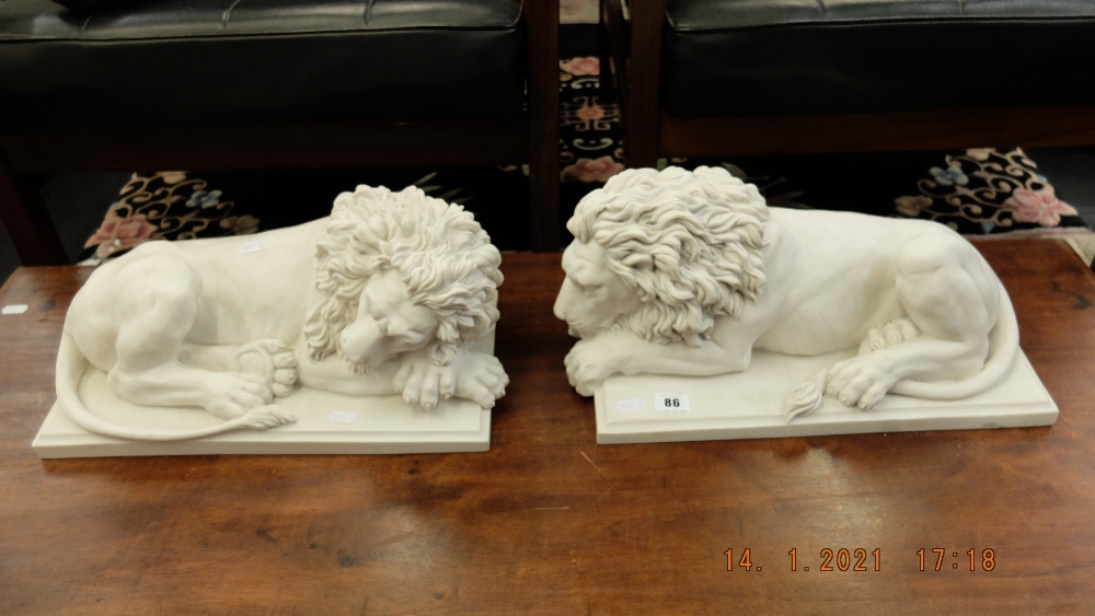 A pair of marbled laying Lions