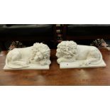 A pair of marbled laying Lions