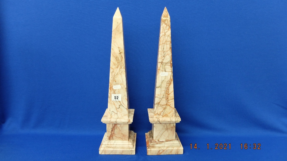 A pair of marble obelisks