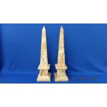 A pair of marble obelisks