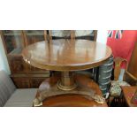 A 19th century mahogany breakfast table