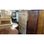 A 19th century pine double wardrobe.