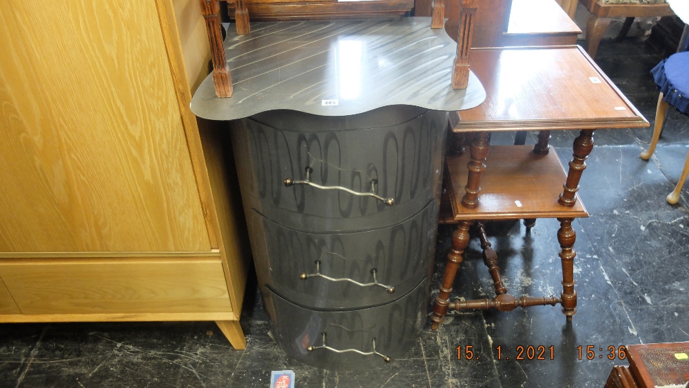 A metal three draw chest in form of barrel