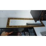 A gilt framed mirror