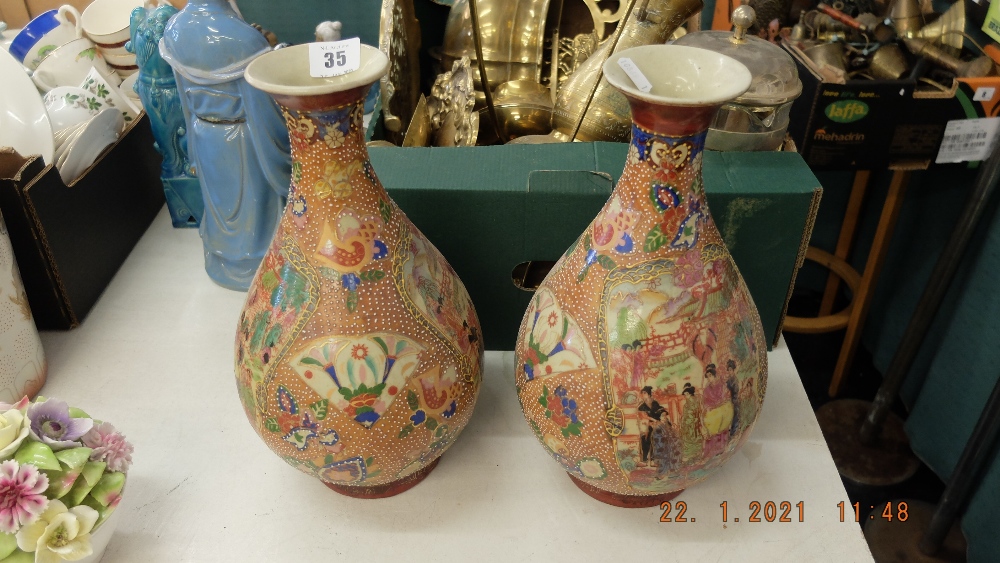 A pair of Satsuma style vases