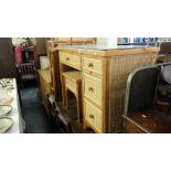 A rattan suite; desk, armchair,