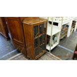 An oak display cabinet inc.